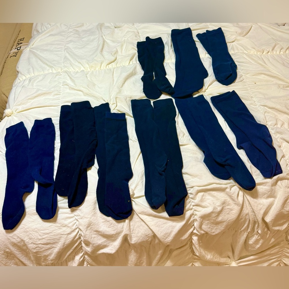 Girls knee high navy blue assorted uniform socks. Barely worn. 9 pair. Size 5-8